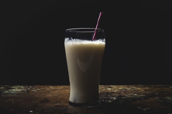 Glass of milk on table