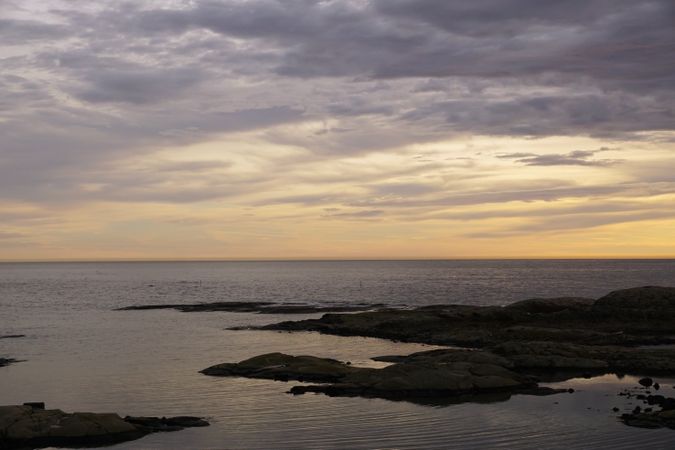 Rocky seashore at peaceful sunset