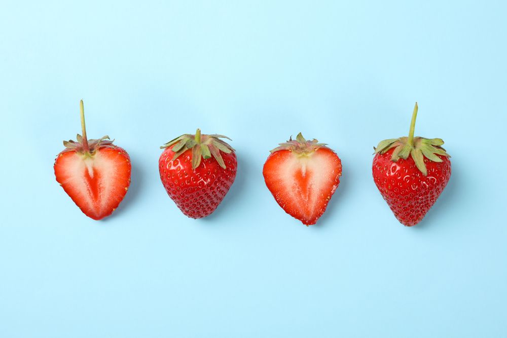 Tasty strawberry on blue background. Summer berry