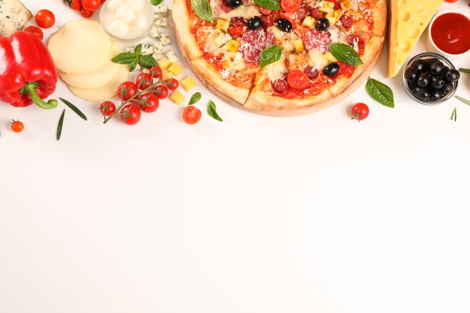 Flat lay. Pizza and ingredients: vegetables, cheese on plain background, copy space