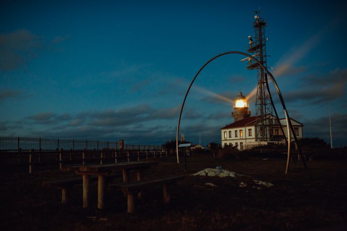 Road and lighthouse in evening