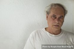 Portrait of upset middle aged man in light shirt 563YY4