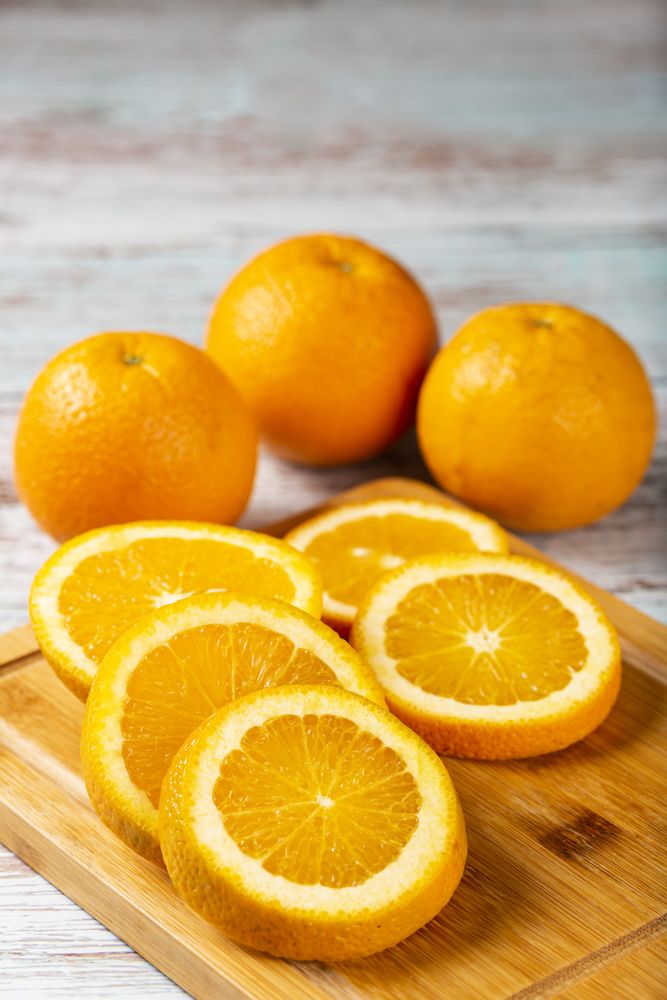 Sliced oranges on the table.