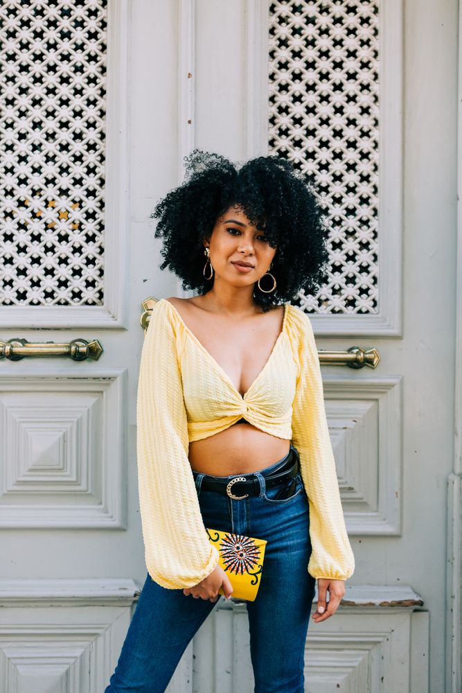 Fashionable female by gray door