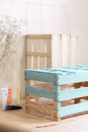Half painted with blue color wooden box