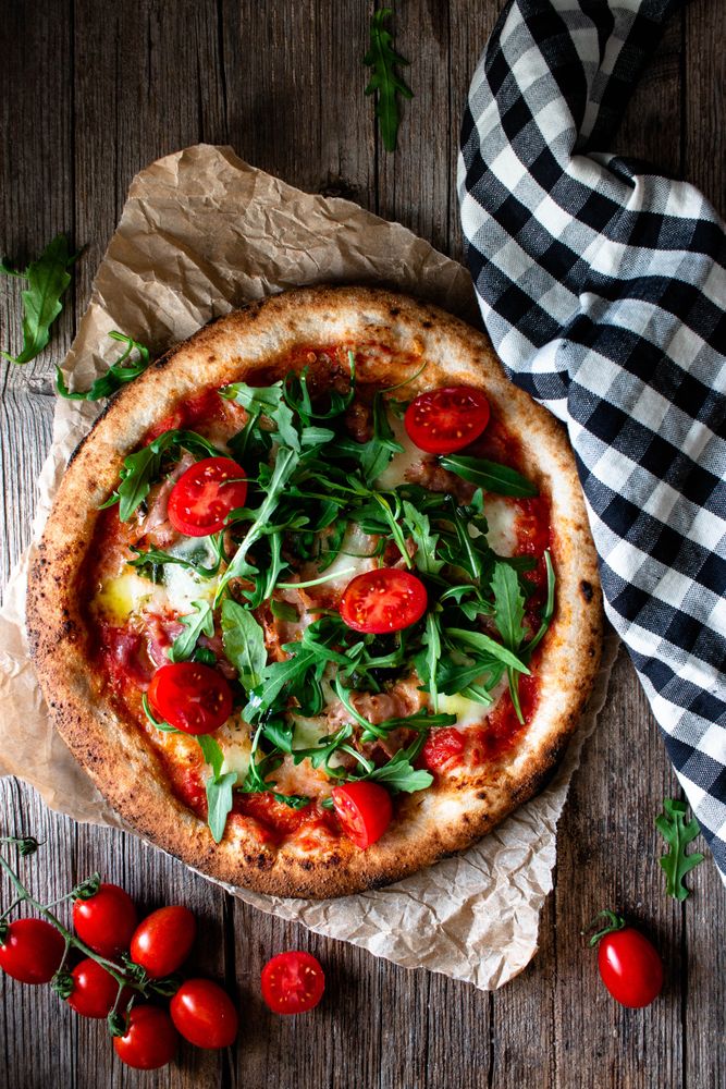 Appetizing pizza placed on wooden table