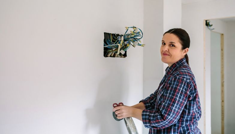 Electrician working on the electrical installation of a house