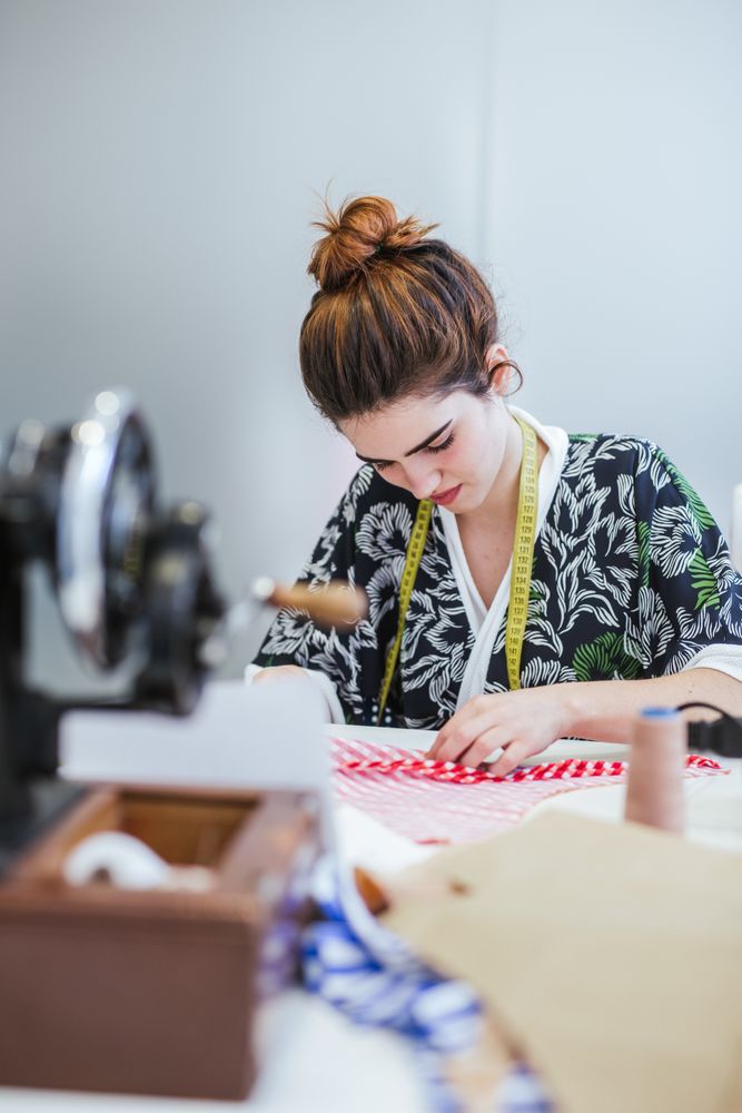 Woman in a sewing school