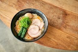 Appetizing traditional Japanese soup with noodles served on table