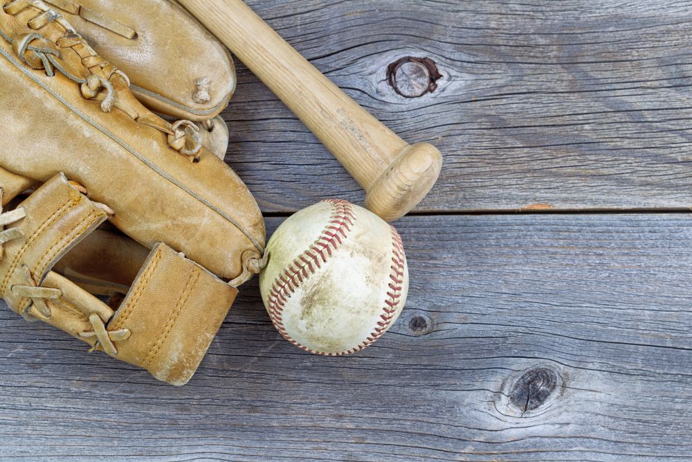 Old Baseball equipment on Aged Wood