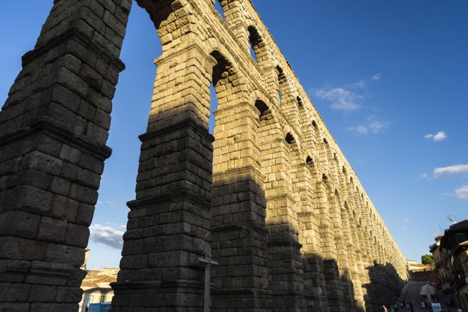 View of the famous Aqueduct of Segovia with mid day shadow