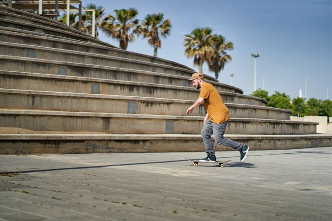 a skater in front of some bleachers