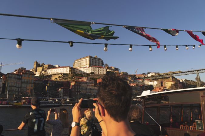 PORTO, PORTUGAL - JANUARY 23, 2019: Tourists on sailing boat viewing city
