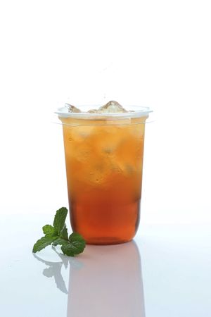 Cold Ice Tea with Mint Leaf on Table