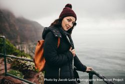 Woman on vacation  at cliff observation point on a winter day bEkoG5