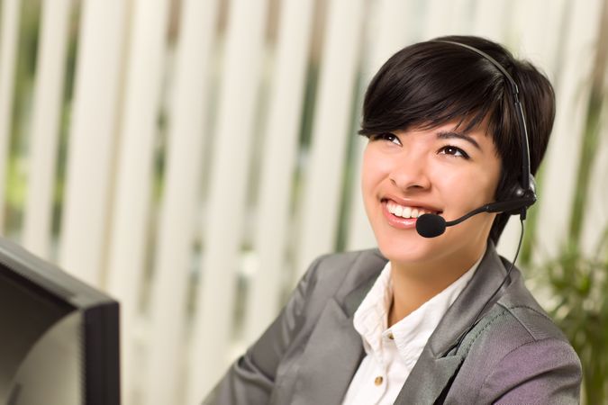 Woman Smiles Wearing Headset
