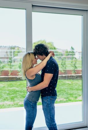 Couple hugging in the living room