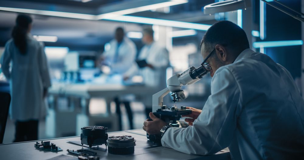 Scientist Using a Modern Digital Microscope in a Research and Development Facility.