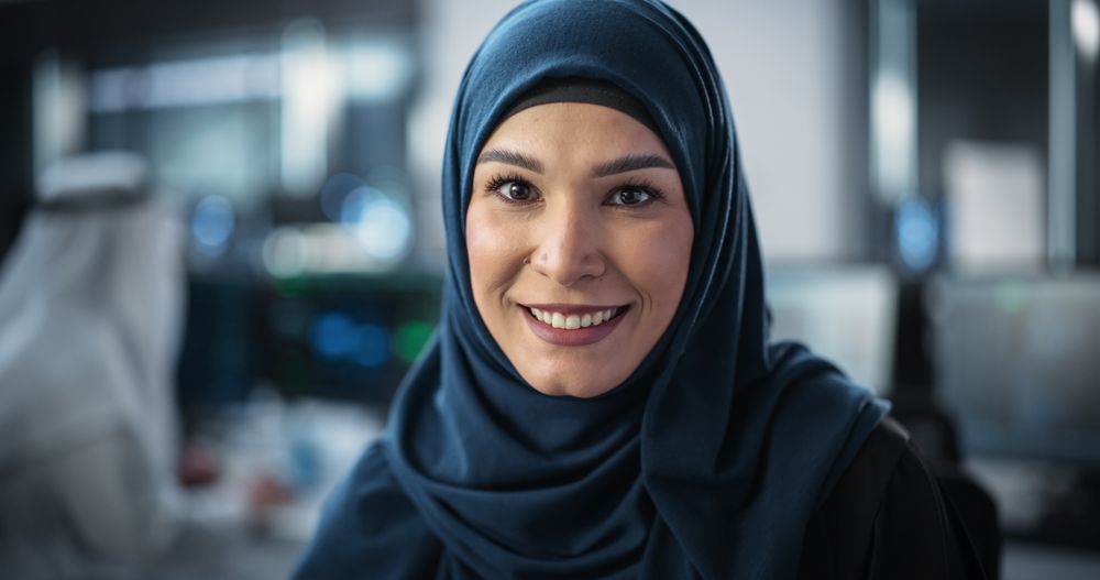 Portrait of a Young Empowered Arab Woman in Hijab Looking at Camera and Charmingly Smiling.
