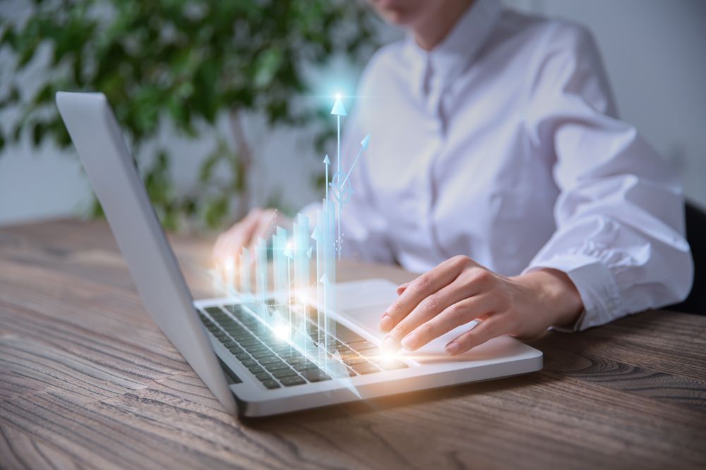 Businesswoman analyzing and calculating financial data for work on laptop