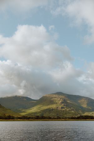 Picturesque view of hills and cloudy sky