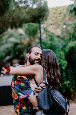 Embracing couple on street laughing