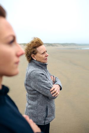 Two women looking at sea