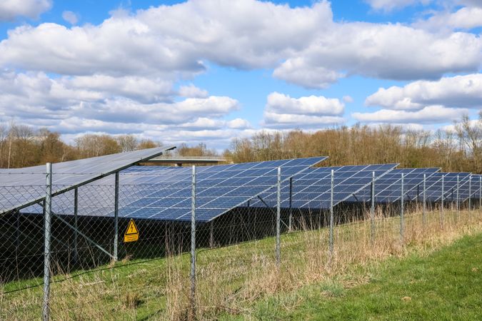 Solar panels providing clean energy under a cloudy sky