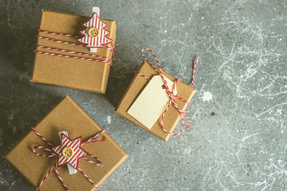 Christmas gifts on counter with label and ornaments