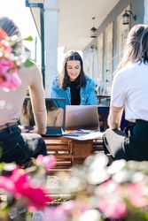 Women giving support and helping each other revising together for university exams and tests.