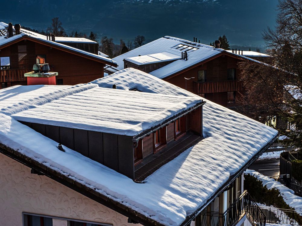 Swiss Alps winter landscape with snow and sun, mountains in Europe