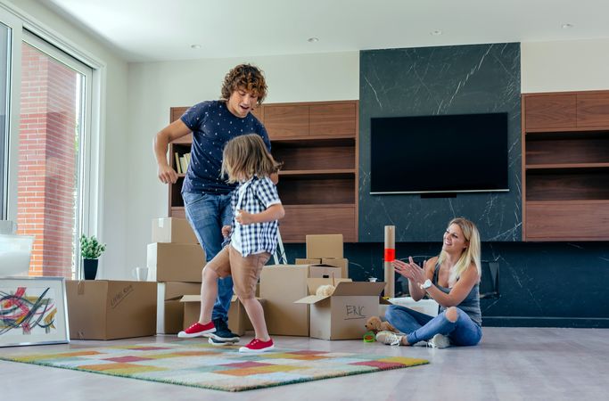 Father and son dancing while mother looks at them