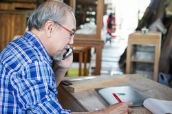Mature business owner on the phone