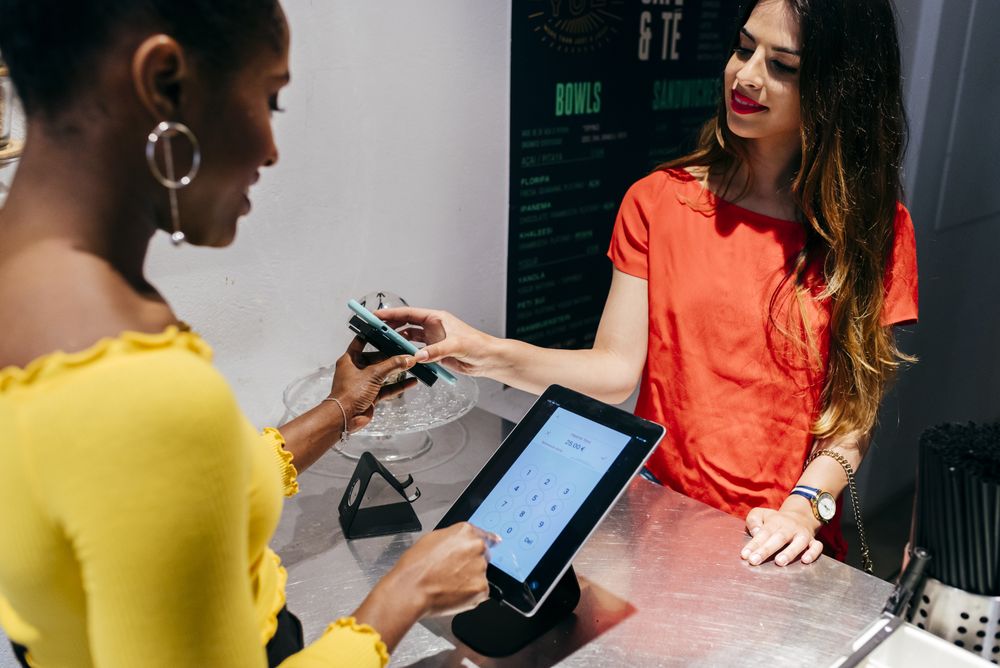 Woman paying cashier