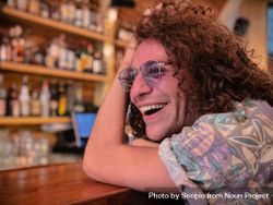 Portrait of man smiling at the bar 4OGzg4
