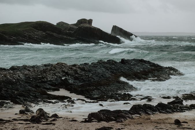 Small island near coast of Scotland on stormy day