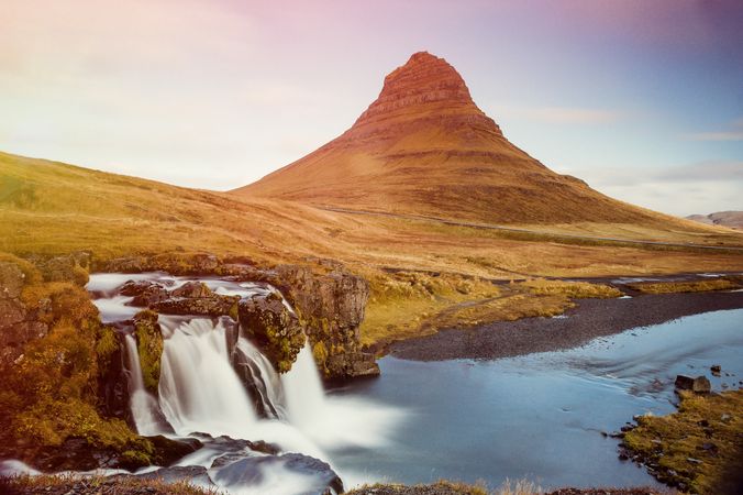 Majestic waterfalls on cliff in mountains