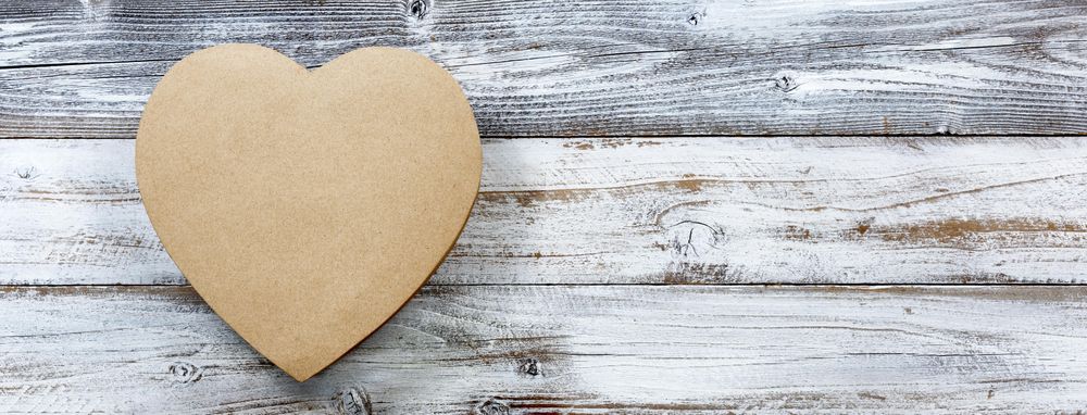 Happy Valentine’s Day with heart shape gift box on wood