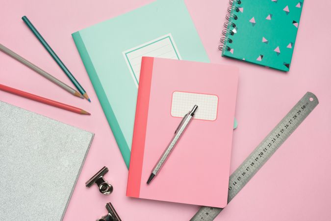 School stationery set on pink background