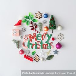 Flat lay of Christmas cookies and decorations in circle, with “Merry Christmas” 4mjZob