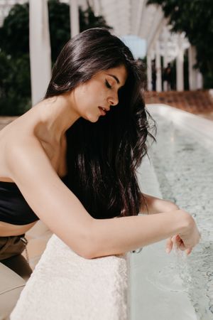 Sensual female relaxing in garden