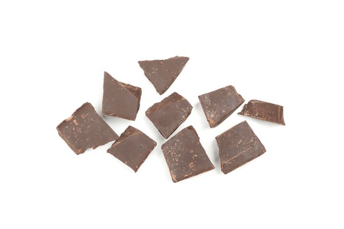 Tasty chocolate pieces isolated on blank background