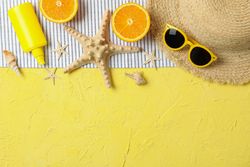 Summer vacation accessories on color background, space for text and top view. Happy holidays