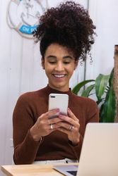 Content Black woman working in cafe