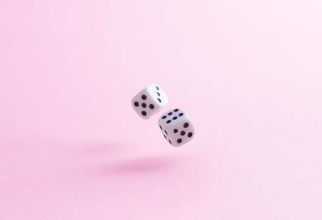 Dice over pink background