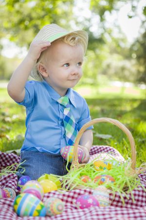 Cute Little Boy Outside Holding Easter Eggs Tips His Hat