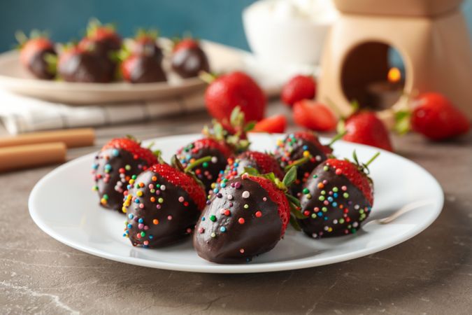 Composition with strawberry in chocolate, close up. Chocolate fondue