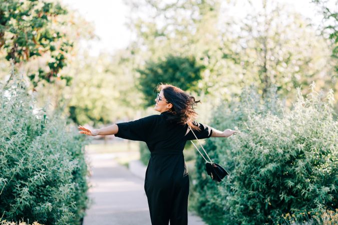 Cheerful female walking in park