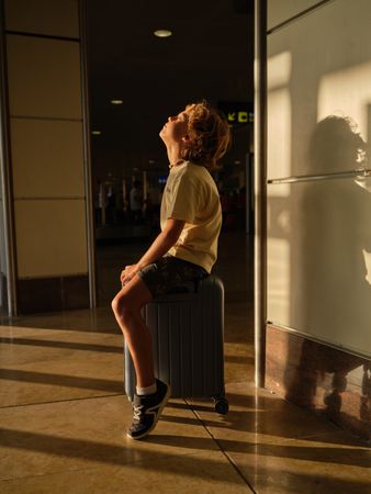 Boy waiting for flight in airport