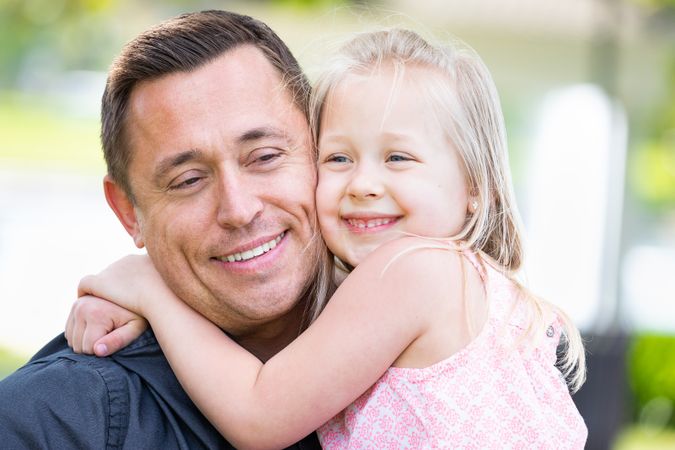 Young Father and Daughter Having Fun At The Park